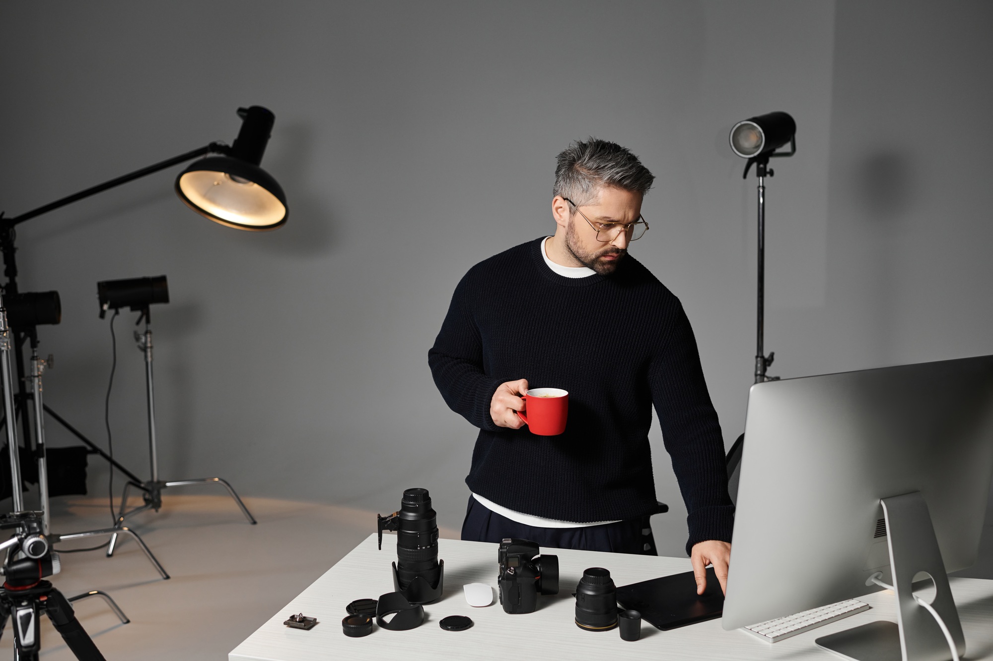 Creative process of a man engaged in photography work in a modern studio setting
